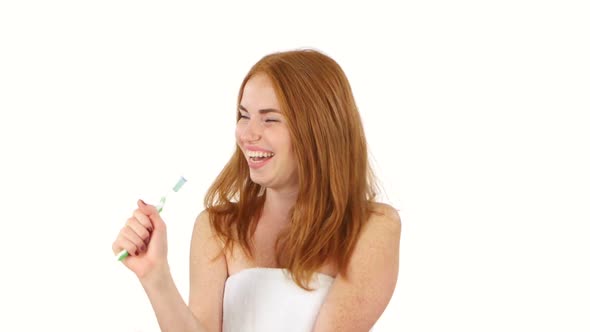 Long-haired Redhead Woman with Ponytail Singing with Toothbrush, Singing, Bathroom