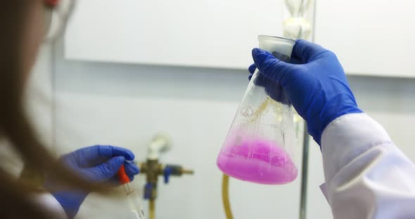 A Laboratory Assistant in a Chemical Laboratory Carries Out Quality Control