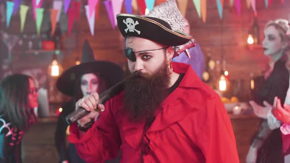 Evil Pirate Dancing at a Fun Halloween Party with His Scary Friends