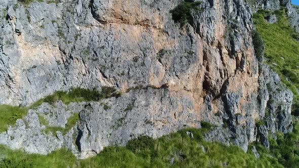 Drone approach to the mountain, panning up