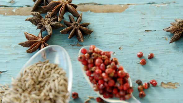 Various spices on wooden table 4k