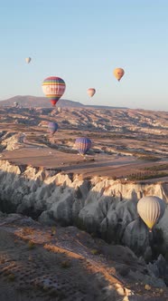 Vertical Video of Hot Air Balloons Flying in the Sky Over Cappadocia Turkey