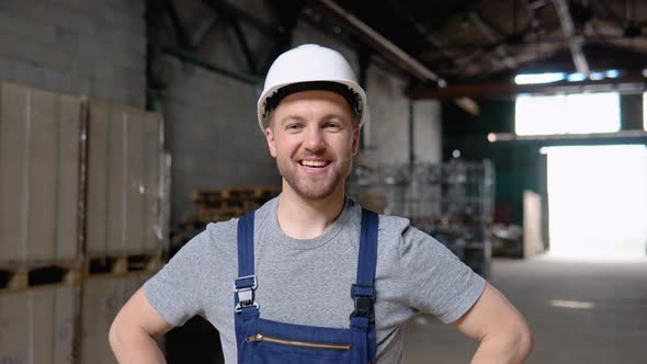 Handsome and Happy Professional Worker in Hat Charmingly Smiling on Camera