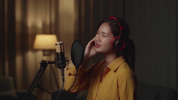 Asian Female Singer Singing In Home Studio