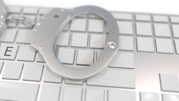 Handcuffs on Keyboard with GAMBLE Text on Keys