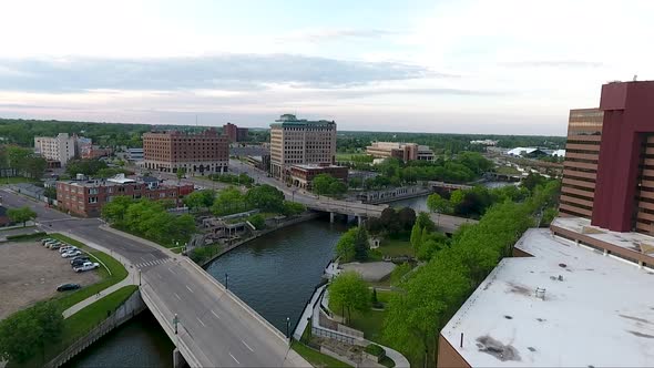 Flying north over Saginaw Street and the Flint River, a drone captures images of downtown Flint, Mic