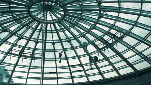 Workers Washing the Roof Made of Glass of a Modern Office Building