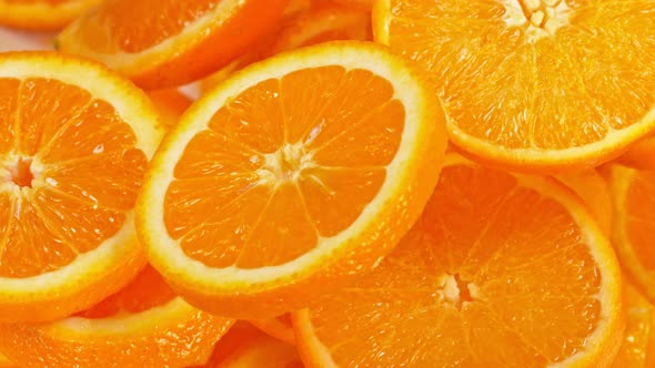 Super Slow Motion Shot of Flying Fresh Orange Slices Towards Camera at 1000 Fps