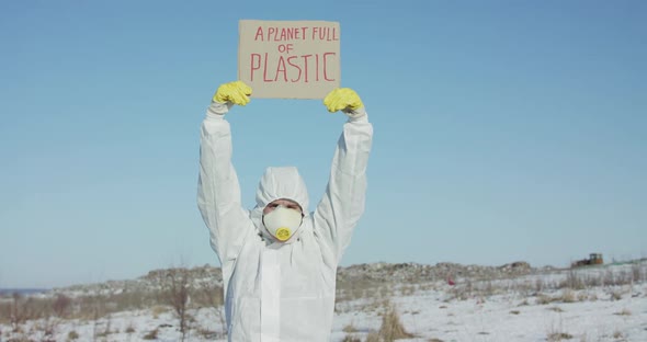 Portrait of Man Wore in Cover Suit Raises Protest Sign a Planet Full of Plastic