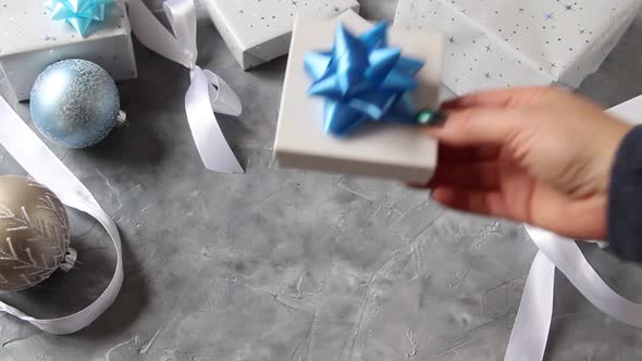 Hand put wrapped present on a table