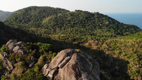 Jungles and Mountains of Tropical Island. Drone View of Green Jungles and Huge Boulders