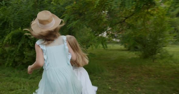 Happy Little Girls Run Through Forest Park Happy Kid Paying in Garden Children