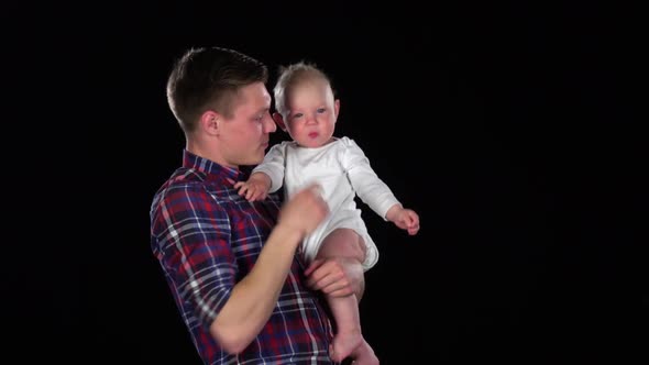 Father and Baby Girl Playing Together. Black