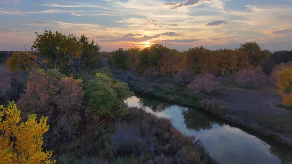 Colors stack in autumn layers in this stunning sunset along the Platte river of Colorado,