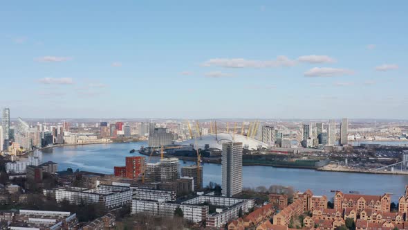 Slider drone shot of The O2 arena London sunny day