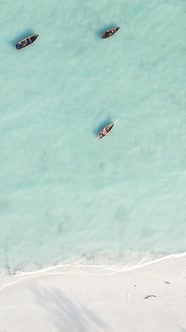 Vertical Video Boats in the Ocean Near the Coast of Zanzibar Tanzania