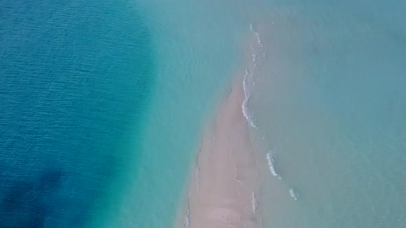 Aerial drone panorama of island beach break by blue sea and sand background