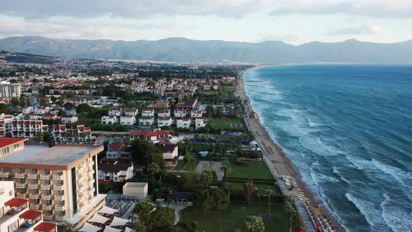 Beautiful cityscape od resort town with hotel buildings on Kusadasi seaside. - aerial birds eye