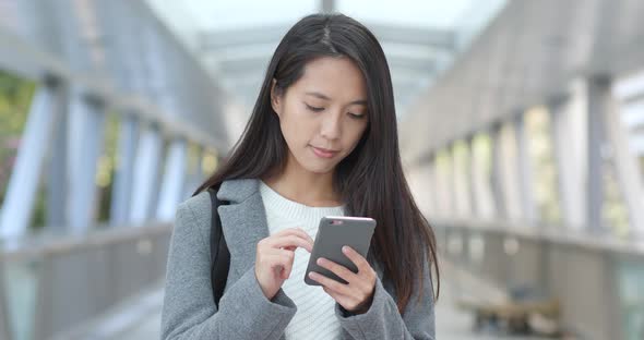 Business woman using smart phone at outdoor