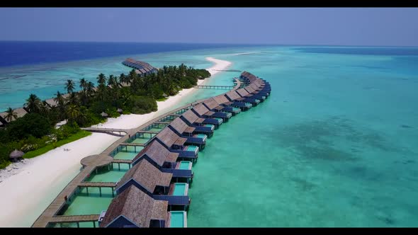 Aerial top view travel of idyllic coastline beach holiday by blue ocean and bright sand background o