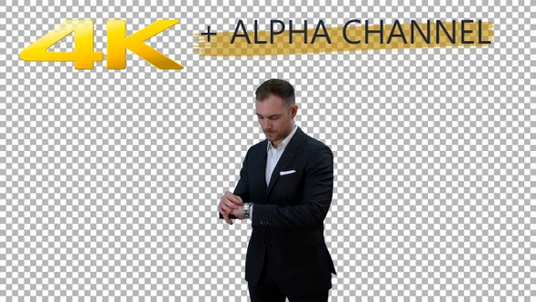 A man adjusts his watch in a classic suit chroma key