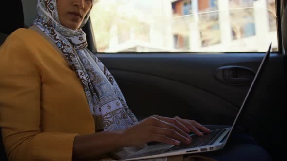 Young woman wearing hijab out and about in the city