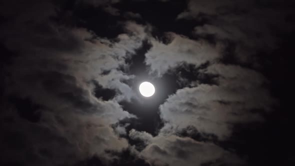 Full Moon Moving Between Clouds, Timelapse