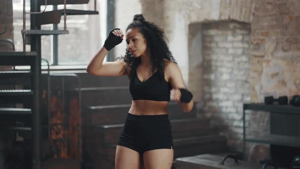 Woman Takes Break Wiping Sweat After Intensive Boxing