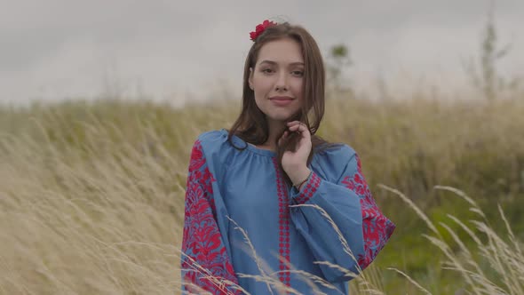 Beautiful Carefree Girl Wearing Long Summer Fashion Dress Looking Confident at Camera Enjoying