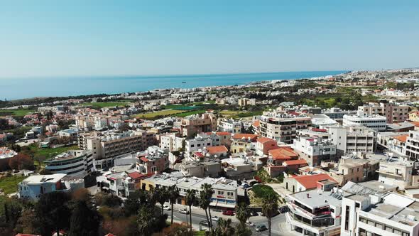 Aerial shot of paphos city in cyprus with buildings and business centers with sea in background. 