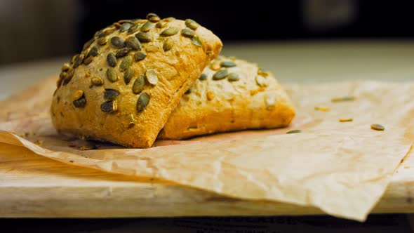 Two Freshly Baked Square Loaves of Bread with Pumpkin Seeds