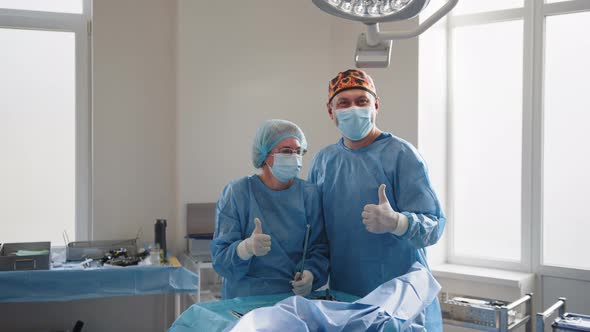 Surgery Medicine and People Concept Group of Surgeons in Operating Room at