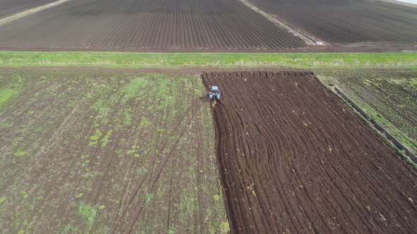 Tractor Plows Farm Land