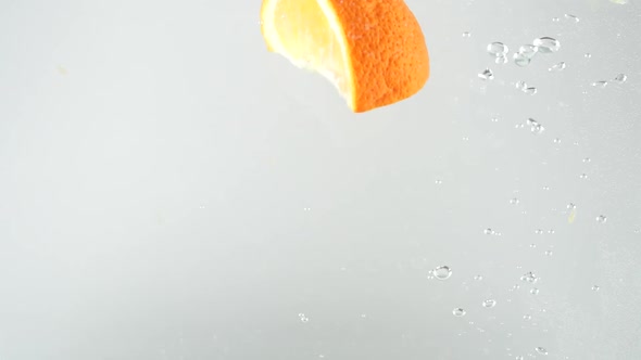 Orange Slices Falling into Water 12