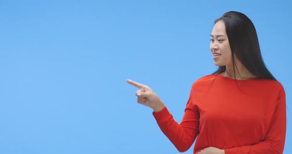 Young Woman Pointing with Finger