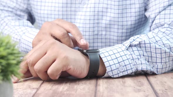 Man's Hand Using Smart Watch