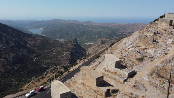 Mills in Motion on Mountain Peak By Mediterranean Sea Crete Greece