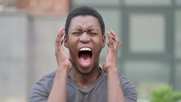 Portrait of Angry Young African Man Shouting, Screaming