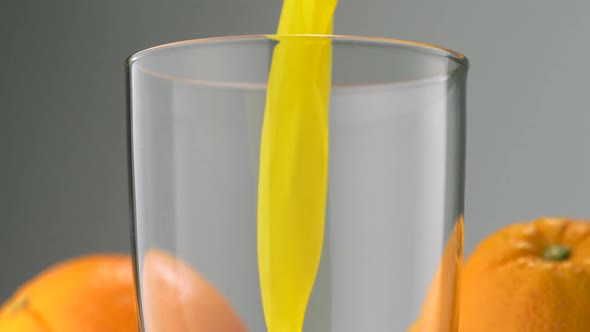 Pouring orange juice into glass, Slow Motion