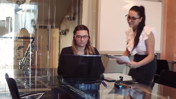 Two Business Women Rejoice and Embrace After One of Them Reported Good News