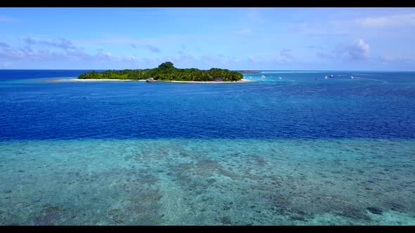 Aerial drone view landscape of perfect shore beach lifestyle by transparent lagoon with white sandy 