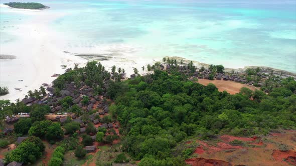 fly over of a tropical island village off Madagascar