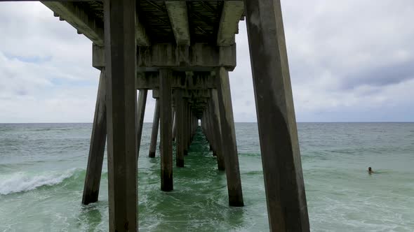 Incredible Aerial Flying View Underneath Pensacola Beach Pier in Florida