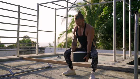 Athletic Man Working Out at an Outdoor Gym. Strength and Motivation.