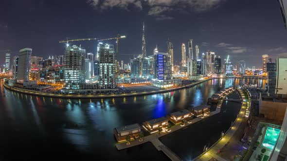 Night City Dubai Near Canal with Bright Skyscrapers Aerial Timelapse