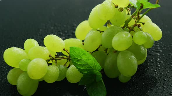 Green Grapes on Wet Table