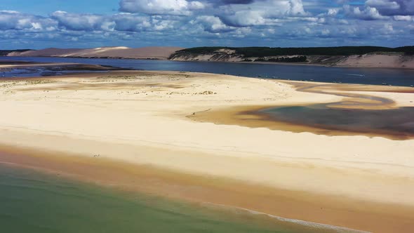 Arcachon Bay France with boats anchored along the Banc d'Arguin sandbank, Aerial dolly left view