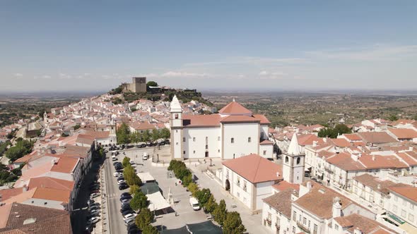 Santa Maria da Devesa church and cityscape, Castelo de Vide in Portugal. Aerial orbit