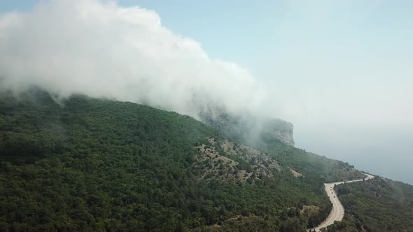 Crimea with Beautiful View of Mountains and Highway Road Between the Mountains. Aerial View Of Fast