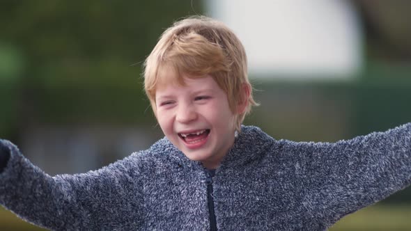 Funny young boy in bear suit has fun on camera alt